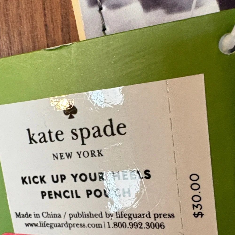 Kate Spade Kick Up Your Heels Black and White Pouch with Gold Accents